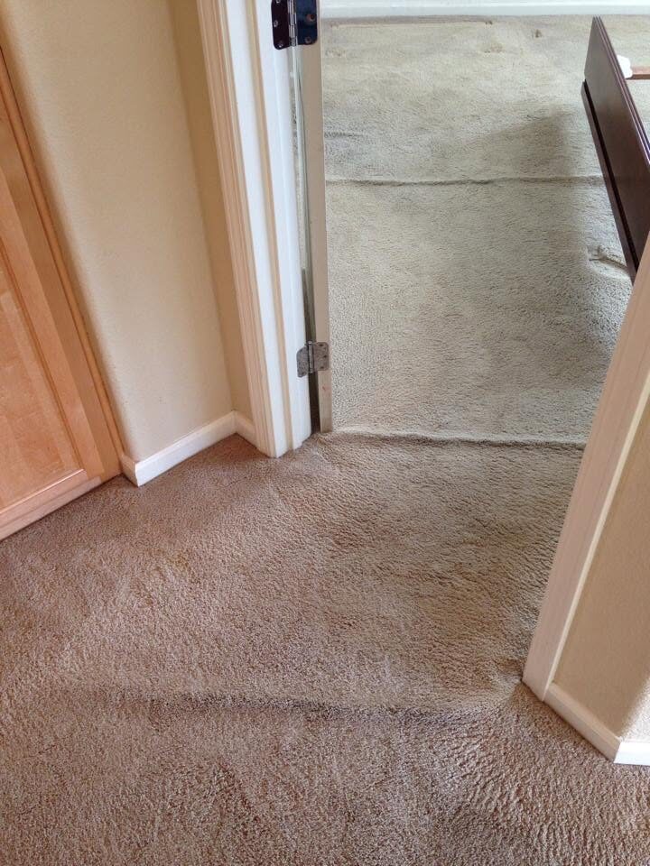 Rippled carpet through a bedroom doorway before restretching